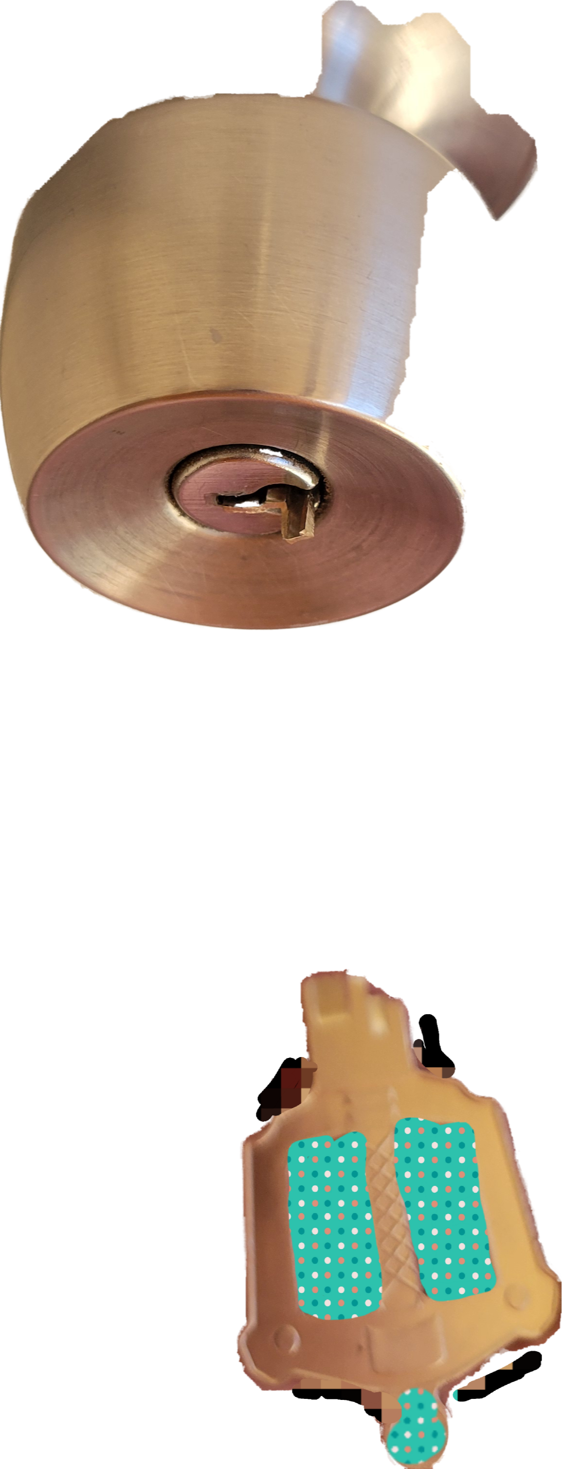 Hands hold broken apart Kingdom Hearts kingdom key house key with a piece of it in a door lock.